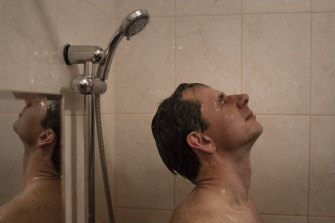 Pavel Rozhkov takes a shower with water heated by a nuclear reactor in Pevek, Russia.