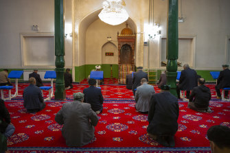 Uighurs and other members of the faithful pray during services at the Id Kah Mosque in Kashgar in western China’s Xinjiang Uyghur Autonomous Region. 