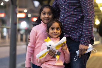 Australian-born Tharnicaa and Kopika Murugappan at Perth Airport on their way home to Biloela.