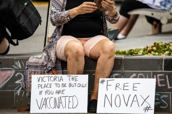 A Novak Djokovic supporter outside the Park Hotel in Melbourne, where the world No.1 is in quarantine ahead of a legal challenge on Monday.