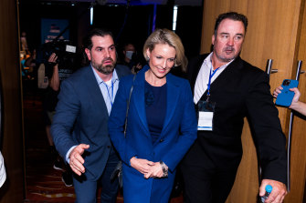 Katherine Deves is escorted from a NSW Liberals function last month. 