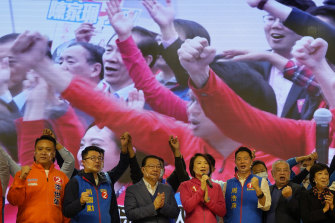 Pro-Beijing candidates, including Starry Lee Wai-king, centre, chairperson of pro-Beijing party Democratic Alliance for Betterment of Hong Kong (DAB), attend a legislative election campaign event on December 5, 2021.