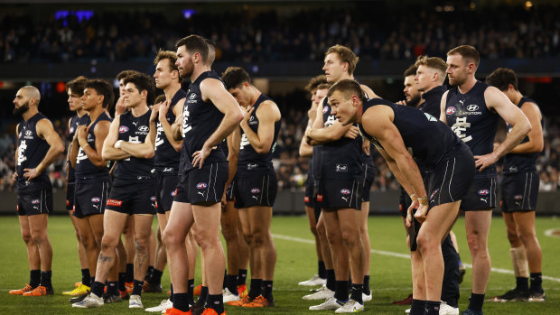 For the want of a behind, a season lost: dejected Carlton look on.