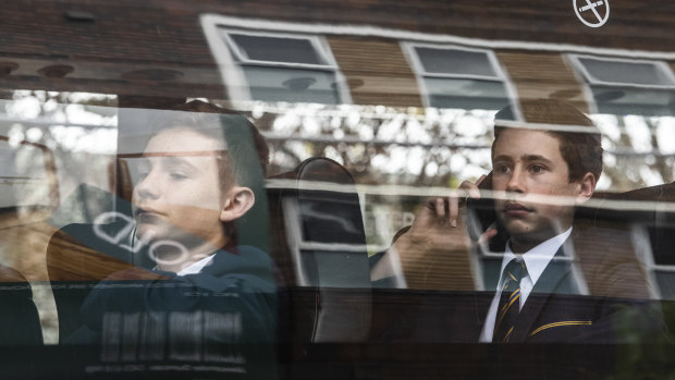 Some students leave Waverley College on private buses.