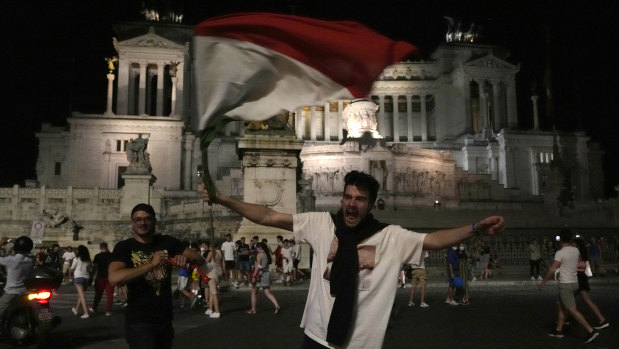 Italian fans celebrate in downtown Rome at the end of the Euro 2020 quarter-final between Belgium and Italy.