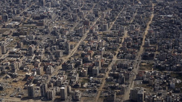 A view of the destruction as a US Air Force plane flies over the Gaza Strip.