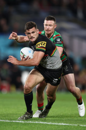 Nathan Cleary is tackled by Damien Cook.