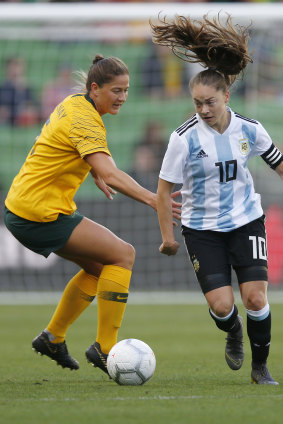 Hair-raising contest: Australia's Laura Alleway takes on Estefania Banini of Argentina during the Cup of Nations match at AAMI Park in Melbourne earlier this month.