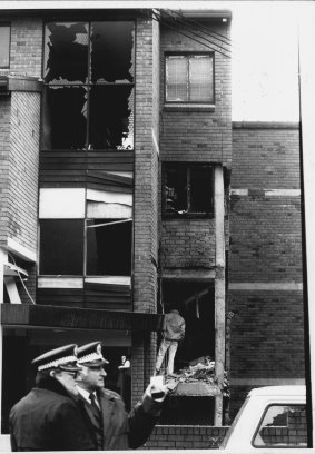 Police outside the blasted entrance to the Watson's residence on July 4, 1984