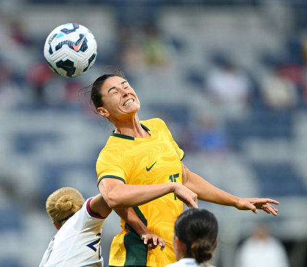 Emily Gielnik of Australia heads the ball.