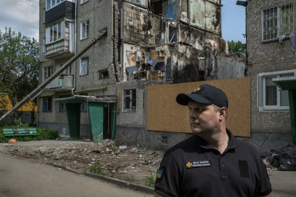Artem, a fire officer, outside the building in Sumy where four people were recently killed.