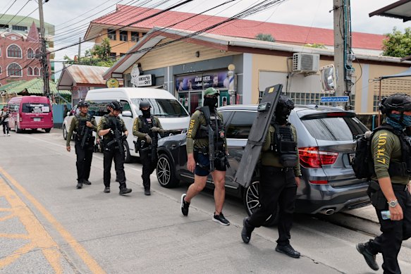 Police patrol outside the school.