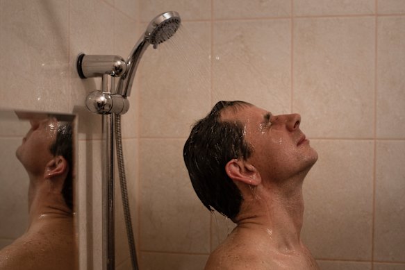 Pavel Rozhkov takes a shower with water heated by a nuclear reactor in Pevek, Russia.