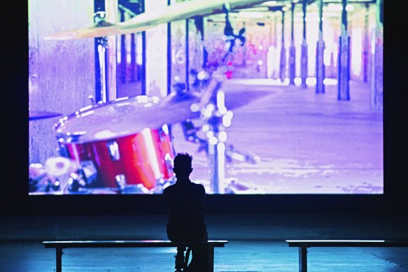 A sole viewer watches the 16-minute performance inside Carriageworks. 