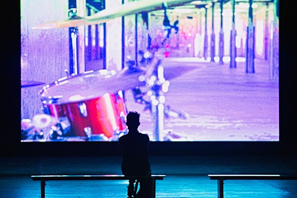 A sole viewer watches the 16-minute performance inside Carriageworks. 