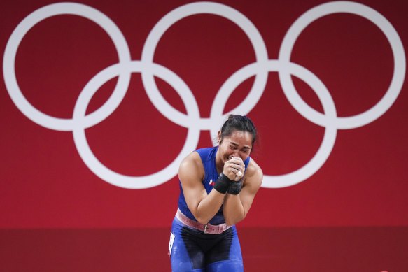 Hidilyn Diaz of the Philippines cries after winning the women’s 55kg weightlifting in Tokyo.