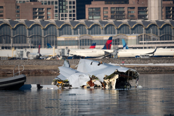 The remains of the American Airlines flight from Wichita, Kansas, which collided midair with a military Black Hawk helicopter.