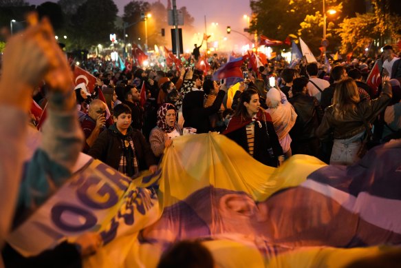 Supporters of President Recep Tayyip Erdogan celebrate in Istanbul.