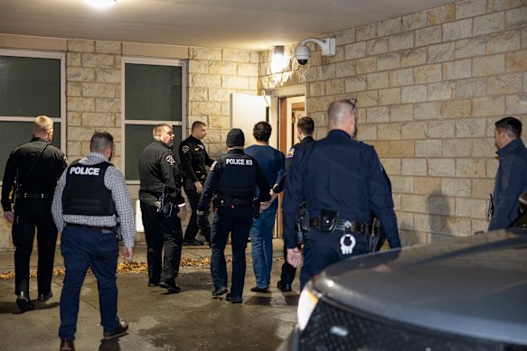 Luigi Mangione is escorted by police   at the Blair County Courthouse in Hollidaysburg, Pennsylvania.