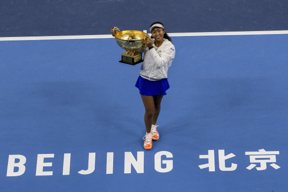 Naomi Osaka of Japan poses with her winner's trophy at the China Open last year.