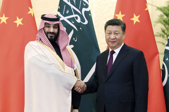 Saudi Crown Prince Mohammad bin Salman, left, shakes hands with Chinese President Xi Jinping in Beijing last year. 