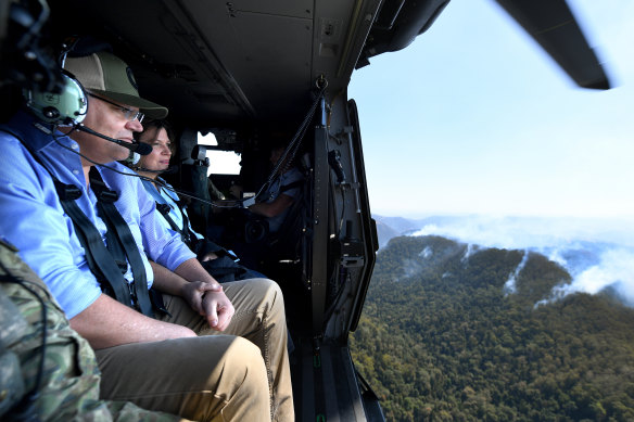 Scott Morrison and his wife Jenny survey the fires in Queensland in September.