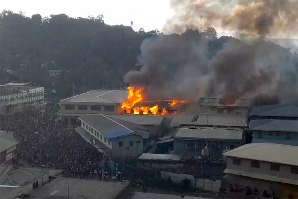 Buildings burn in Honiara, the Solomon Islands capital. 