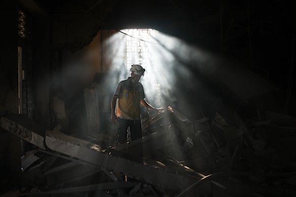 A member of Syria’s civil defence works in the aftermath of an Israeli airstrike on Syria’s defence ministry headquarters on Wednesday.