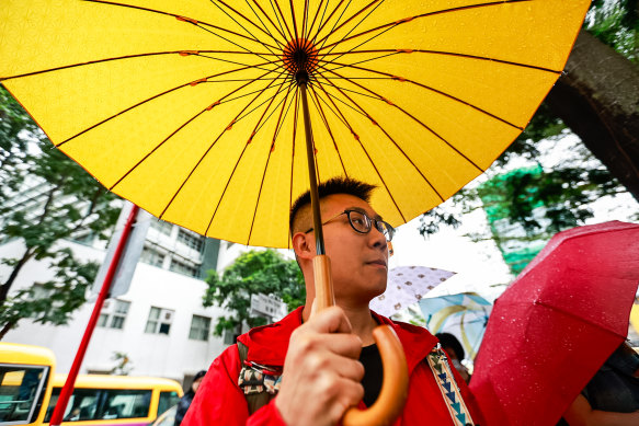 Pro-democracy activist Raphael Wong queues up for public gallery seats ahead of the sentencing of the 45 pro-democracy activists convicted in Hong Kong’s largest national security case.