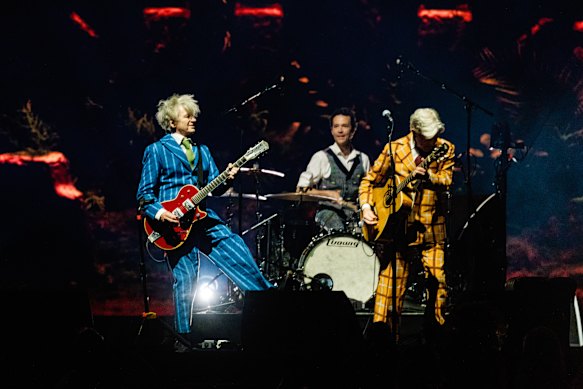 Neil and Tim Finn and drummer Matt Eccles of Split Enz perform at Rod Laver Arena on Wednesday night.