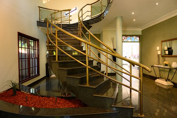 The entryway to 262 Hawthorne Parade is dominated by a sweeping staircase.