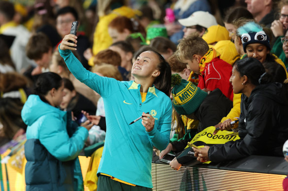 Amy Sayer caps a strong performance with a post-match fan selfie.