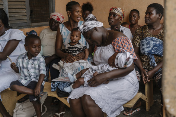 Mothers and babies waiting for shots in Accra, Ghana.