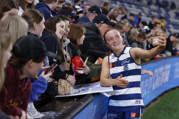 Zali Friswell celebrates with Geelong fans after the Cats’ win.