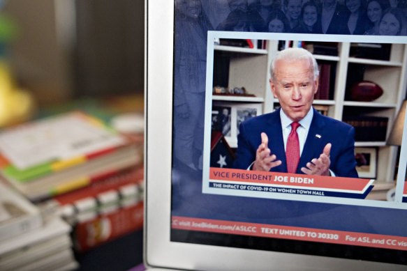 Presumptive Democratic presidential nominee Joe Biden speaks during a virtual event seen on a laptop in Arlington, Virginia.