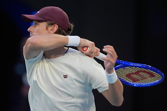 De Minaur crunches a forehand return serve.