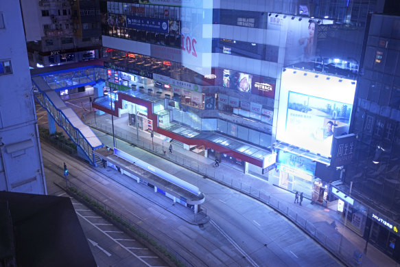 Hong Kong’s neon lights are still on, but the main street in Causeway Bay usually packed with shoppers is quiet.