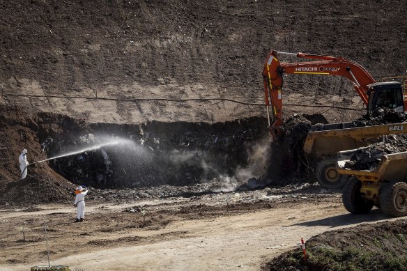 Workers in 2022 at Barro Landfill in Kealba, where an underground fire burnt for years.