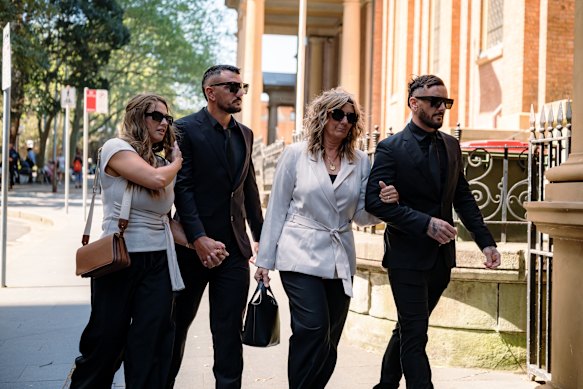 Sandra Davies, mother of Luke Davies, second from the right, arrives at the Supreme Court with family on Monday. 