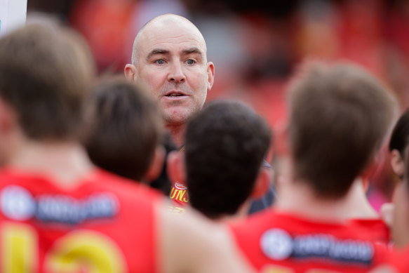 Steven King addresses the Gold Coast players in his first game as interim coach of the club.