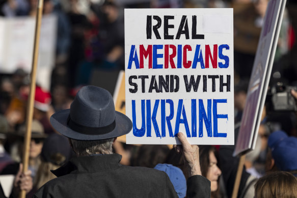 Demonstrators gather to protest against Trump’s policies on Monday.