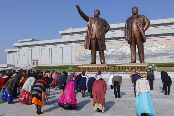 People visit the statues of their late leaders Kim Il-sung and Kim Jong-il on the occasion of the Day of the Sun, the birth anniversary of Kim Il-sung, in Pyongyang, North Korea on April 15, 2021. 