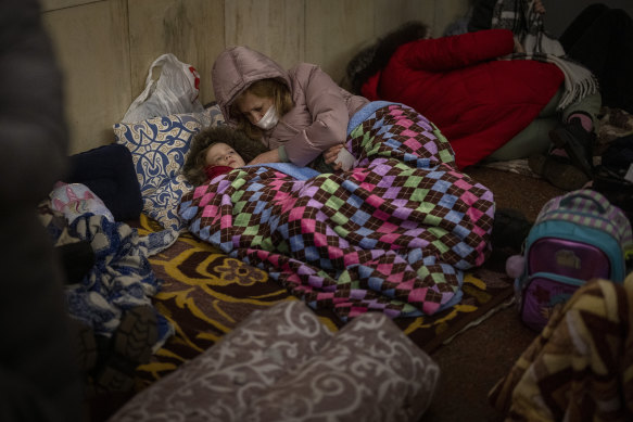 People rest in the Kyiv subway, using it as a bomb shelter.