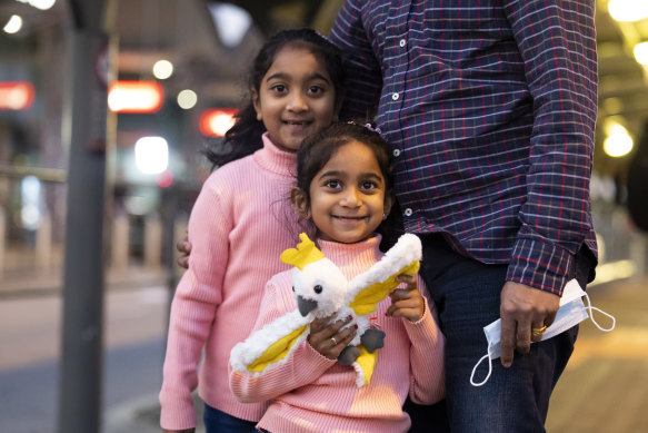 Australian-born Tharnicaa and Kopika Murugappan at Perth Airport  on their way home to Biloela.