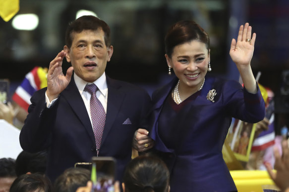 King Maha Vajiralongkorn and Queen Suthida, his fourth wife, wave to supporters in Bangkok in 2020.
