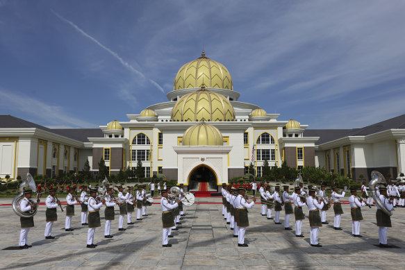 Military band perform during a welcoming ceremony of the 17th King of Malaysia.