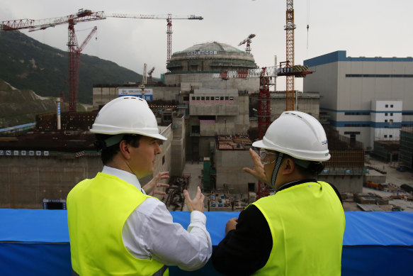 A 2013 file photo of the George Osborne, then the UK’s Chancellor of the Exchequer, with Taishan Nuclear Power Joint Venture general manager Guo Liming.