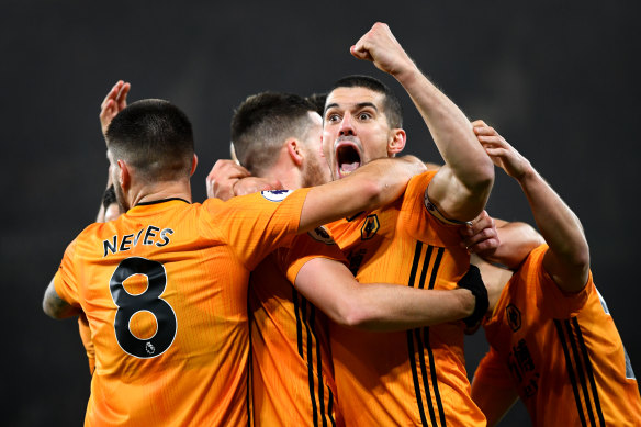 Wolves' Conor Coady celebrates his side's third goal with teammates.