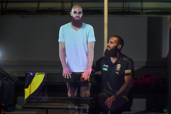 Bachar Houli watches his hologram exhibit at the soon-to-be-reopened Australian Sports Museum.