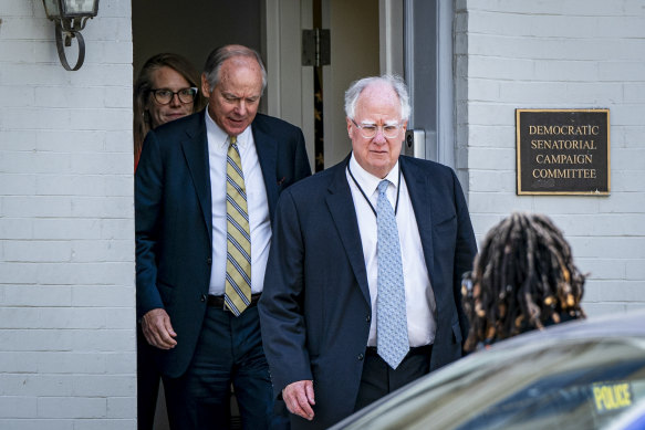 Mike Donilon (left), Biden’s chief strategist, and Steve Ricchetti, one of the president’s closest advisers, leave after a meeting with Senate Democrats in Washington this month.